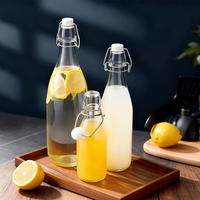 Venta al por mayor Swing Top botella de vidrio 60ml 100mL 250ml 500ml 750ml 1000ml hermético transparente redondo bebida jugo cerveza agua leche