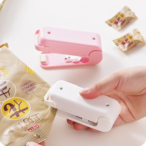 <b>Mini</b> <b>Hand</b> Operated Heat Sealing Machine For Snack Bags 9x4x6cm Pink White With Magnetism - Product Image 1