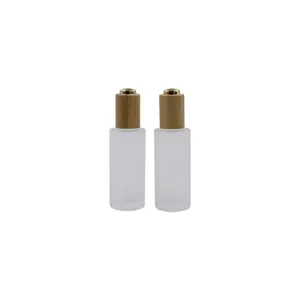 15ml Hautpflege verpackung umwelt freundliche gefrostete farblose Glasflasche mit bambus beschichtetem Gold pumpen tropfer