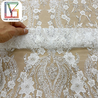 Nouveau design de tissu en dentelle française brodée, tissu en dentelle perlée, tissu en dentelle à paillettes pour robes de mariée pour femmes