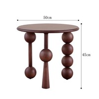 Table d'appoint de salon moderne en bois massif noir, style rétro nostalgique, avec pieds asymétriques en forme de boule et de cône, table d'appoint de canapé