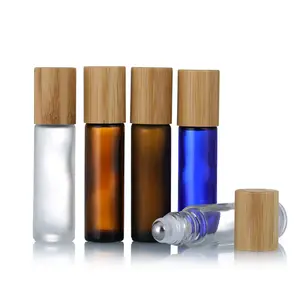 Empty bamboo lid essential oil transparent amber frosted glass roll on perfume bottle with steel roller ball 5ml 10ml 15ml