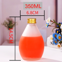 Bouteille de boisson en verre en forme de goutte d'eau avec bouchon à vis en aluminium pour l'emballage de jus, de lait, de thé et de boissons froides
