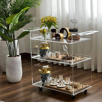 Arabie Saoudite Vente chaude Chariot de bar moderne à 3 niveaux en acrylique transparent Lucite pour salle à manger, hôtel, service de boissons, chariot à roulettes