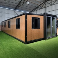 Maison conteneur modulaire pliable et extensible de 20 pieds, alimentée à l'énergie solaire, en panneaux sandwich d'acier ignifugés, avec bureau et salle de bain