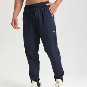 Venta caliente Fitness Jogging Gym Pantalones de chándal Ligero en blanco Hombres Pantalones de chándal Joggers personalizados Pantalones deportivos de secado rápido