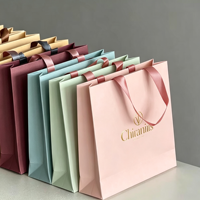 Sac à main de shopping haut de gamme en carton blanc, logo personnalisé ODM OEM, matériau épaissi résistant pour transporter 6-9 kg d'articles quotidiens