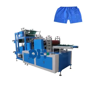 Machine pour la fabrication de pantalons jetables, non tissés, pièces