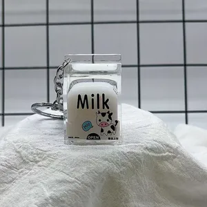 Kustom lucu karton susu Glitter pasir hisap di dalam bergerak transparan pengocok akrilik mengambang diisi minyak cairan gantungan kunci