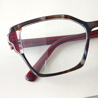 Lunettes optiques en acétate d'oeil de chat à la mode montures de lunettes de couleur populaires avec type de motif solide de stratification