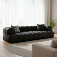 Canapé d'angle style crème inspiré de la texture des nuages noirs Marshmallow pour petit appartement, hôtel, villa, avec revêtement en tissu