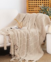 Plaid en tricot torsadé de luxe avec pompons pour la literie ou le canapé