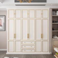 Armoire Moderne Minimaliste Blanche avec Poignées Dorées Grande Capacité pour Chambre à Coucher avec Tiroirs et Portes pour la Maison