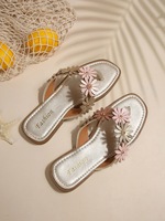 Nouvelles sandales plates à fleurs marguerites pour femmes, tongs décontractées pour la plage et l'extérieur