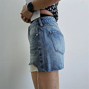 OEM vente en gros personnalisé été femmes jupe en jean en détresse ourlet effiloché mini jupe Streetwear délavé bleu jean jupe - Product Image 3