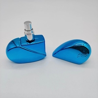 Vaporisateur de parfum en verre vide coloré en forme de coeur portable 25ml avec placage UV pour femmes