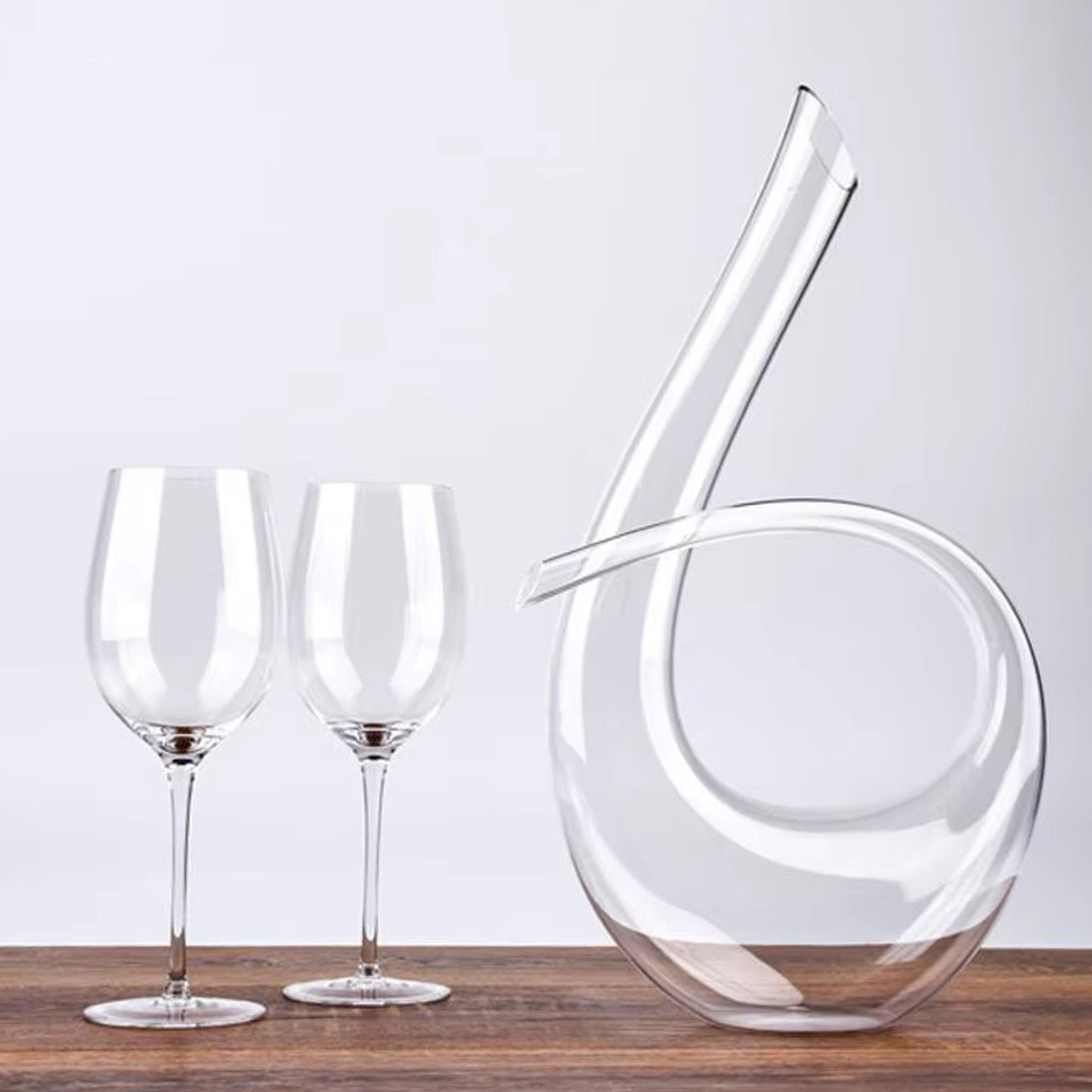 A decanter and two wine glasses