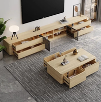 Ensemble de meuble TV et table basse modernes haut de gamme pour petits appartements, avec un support TV sur pied mobile et durable.