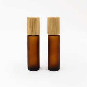Eco-friendly 5ml 10ml Matte Amber <b>Glass</b> Roll <b>on</b> Bottle with Bamboo Lid Empty Cosmetic Essential Oil Roller Bottle - Product Image 1