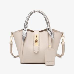 Litchi-grain leather women's <b>bag</b> with <b>gold</b> lock and designer tag - Product Image 5