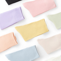 Nouveau mignon couleur unie sans couture moyen Tube chaussettes bonbons lumière avec dessin animé Logo tricoté coton équipage chaussettes doux petit coloré