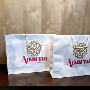 Wholesale White <b>Paper</b> Carry Bags with Custom Logo Luxury Retail Shopping Gift Packaging Bags for Clothing Stores - Product Image 1