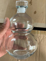 Bouteille de boisson en verre de 350ml en forme de gourde de conception unique pour le vinaigre de pomme de jus avec couvercle en métal