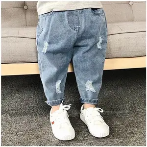 Quần áo trẻ em Quần jean rách dài mùa xuân mùa thu 1-8 tuổi lỏng bé gái quần jeans