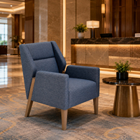 Fauteuil rembourré bleu pour l'hôtellerie, idéal pour les chambres d'hôtel, les suites, les halls d'accueil et les achats en gros