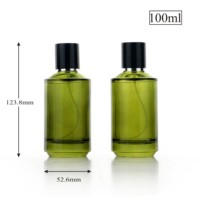 Flacon de parfum vide de luxe haut de gamme 100 ml transparent vert olive avec design d'épaule spécial et vaporisateur de brume parfumée