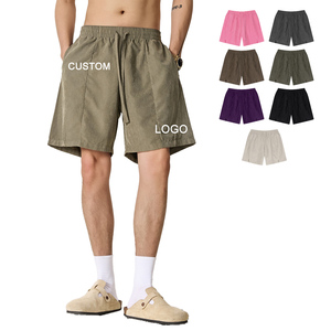 Shorts de course pour hommes en polyester à séchage rapide, imperméables, avec cordon de serrage, poches, logo personnalisé, coupe ample, pour la gym et l'entraînement sportif - Product Image 1