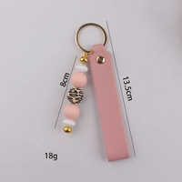 Porte-clés en cuir PU avec breloque de sac en silicone perlé imprimé léopard, pendentif de clé de voiture fait main, accessoire de mode féminin pour cadeau
