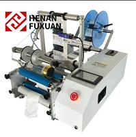 Machine d'étiquetage semi-automatique pour bouteilles rondes avec codeur de date