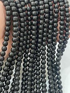 Perles rondes lisses en hématite naturelle de haute qualité avec cordon extensible blanc - Product Image 5