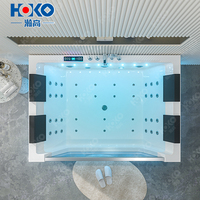 Baignoire hydromassante en acrylique blanc pour 4 personnes avec système de massage par remous Spa pour salle de bain Utilisation hôtelière Caractéristiques propres