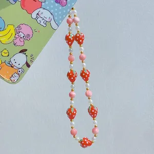 Chaîne de téléphone portable mignonne en perles de fraise accessoires de téléphone portable pour femmes et filles lanière de téléphone portable en pierre rose - Product Image 1