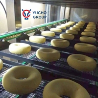 Ligne de production de machines à beignets/donuts entièrement automatiques industrielles Yucho Professional avec acier inoxydable 304 et PLC de marque réputée