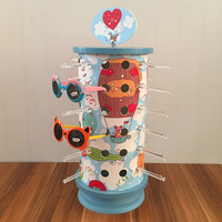 Vente en gros des fabricants Nouveau support rotatif de carrousel à lunettes 360 Présentoir de lunettes pour enfants
