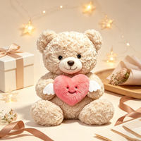Ourson en peluche marron doux et moelleux, tenant un cœur avec des ailes d'ange, idéal pour un cadeau de Saint-Valentin - Vente en gros usine