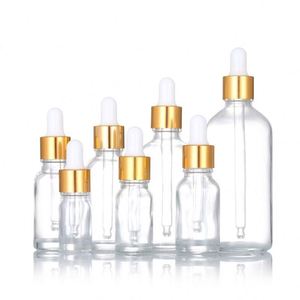 ขวดแก้วใสสำหรับน้ำมันใส่ผมพร้อมหัวหยดสีทอง พิมพ์ลายสกรีน ขนาด 5 มล.-100 มล. สำหรับน้ำมันหอมระเหยและเครื่องสำอาง - Product Image 1