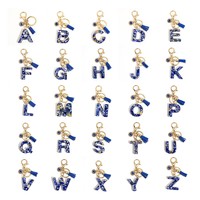 Porte-clés en résine Lettre Œil Turc avec breloque alphabet incrustée de feuille d'or, pompon et accessoires dorés, accessoire de mode pour sac