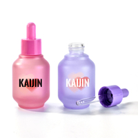 Flacon compte-gouttes en verre cosmétique de luxe personnalisé de 30 ml avec bouton poussoir pour les gouttes pour les yeux et le sérum lotion avec finition macaron