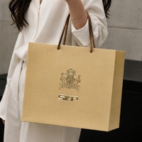Sac en papier durable pour produits électroniques, sac d'emballage de vente au détail en carton blanc, sac de transport personnalisé avec logo pour les boutiques de gadgets