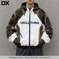 Veste zippée personnalisée en camouflage Woodland colorblock 380 g/m² avec bandes de fermeture éclair contrastantes, coupe oversize et carrée, coupe-vent streetwear OEM ODM