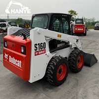 Chargeuse compacte Bobcat S160 d'occasion, faible nombre d'heures de travail, système hydraulique d'origine, pour l'aménagement paysager et l'entretien routier