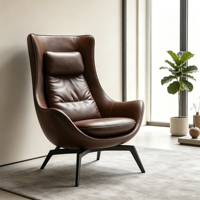 Fauteuil d'appoint relaxant à dossier haut en cuir marron avec structure à quatre pieds en fibre de verre électroplaquée mate pour salon