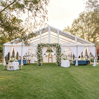 Tente de réception de luxe TENTCHO à structure en aluminium avec toit en PVC transparent et murs en verre pour événements de mariage en plein air
