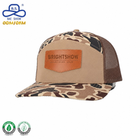 Gorra Personalizada de Primera Calidad con Parches de Cuero con Logotipo Personalizado, Gorra Trucker con Patrón de Camuflaje y Malla de Poliéster Transpirable para Unisex