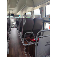 Bus de transport luxueux, spacieux et confortable de 70 places avec toit surélevé pour les voyages de passagers et le tourisme de groupe