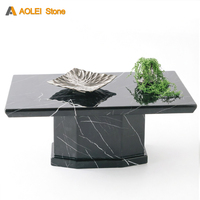 Table à manger géométrique moderne avant-gardiste à base lourde en marbre Nero Marquina pour salles à manger de villas de luxe et espaces artistiques de créateurs